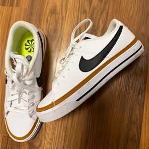 Nike women’s White Low-Top Sneakers with Black Swoosh and Brown Trim